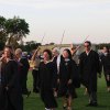 Teachers and staff members file into the stadium.